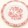 Vintage red and white floral plate with scalloped edges and gold accents for elegant décor.