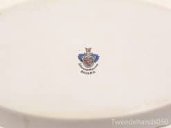 Elegant white ceramic platter with Bavarian crest, perfect for decor or collection.