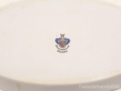Elegant white ceramic platter with Bavarian crest, perfect for decor or collection.