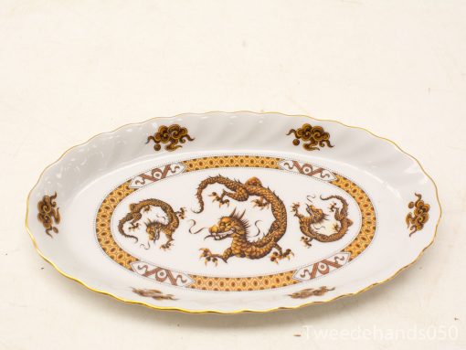 Elegant antique porcelain serving platter featuring intricate dragon motif and scalloped edges.