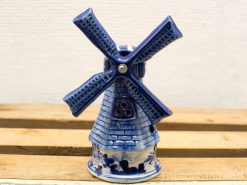 Antique blue and white ceramic windmill, showcasing Dutch craftsmanship and cultural heritage.