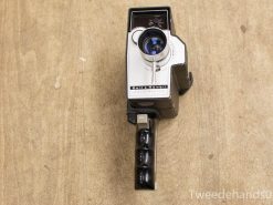 Vintage Bell & Howell film camera with sleek design and blue-tinted lens.