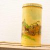Vintage tin container featuring a nostalgic horse-drawn carriage in a charming countryside scene.