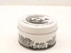 Charming vintage tin with cow illustration, Löwenstein Friesland, perfect for collectors and decor.