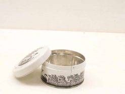 Vintage black and white swan tin canister with lid, perfect for kitchen storage.