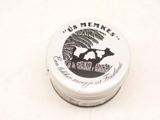 Vintage Friesland tin with playful cow design, perfect for collectors and sweet treats.