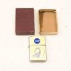 Vintage roller coaster lighter with TRIP logo, stylish faux leather packaging, nostalgic collectible.
