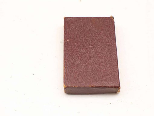 Vintage brown rectangular object, perfect for art, writing, or as a unique collectible.