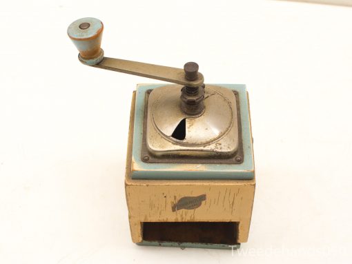 Charming vintage coffee grinder with yellow base and blue accents for manual grinding enthusiasts.