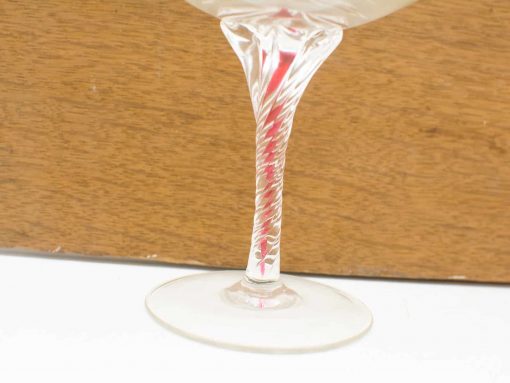 Elegant crystal cocktail glass with twisted stem, perfect for any occasion or collection.