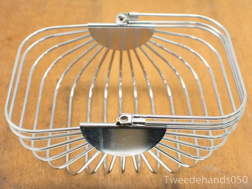 Elegant modern metallic basket with a structured design, perfect for displaying fruits or baked goods.