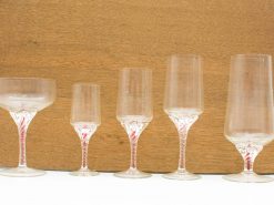 Elegant vintage glassware set for cocktails and wine, perfect for any occasion.