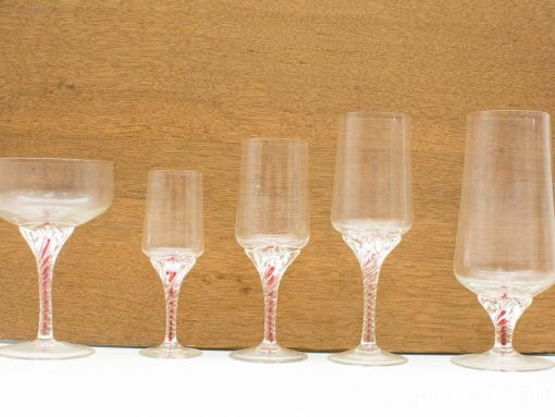 Elegant vintage glassware set for cocktails and wine, perfect for any occasion.