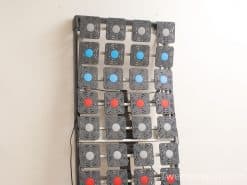 Colorful buttons on a steel panel, ideal for interactive gaming or educational displays.