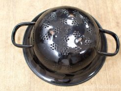 Sleek black colander with handles for draining pasta and washing vegetables in style.