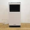 Portable air conditioner with sleek white and black design, perfect for indoor cooling in small spaces.