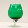 Elegant green glass goblet, perfect for decor or special occasions, enhancing any table setting.