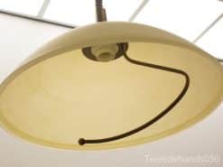 Elegant vintage dome lamp with creamy yellow shade, enhancing cozy interiors with soft illumination.