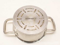 Vintage HERMAN stainless steel pot with ventilation lid, perfect for versatile cooking.