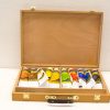 Elegant wooden paint box showcasing organized colorful paint tubes for artistic inspiration.