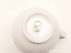 Vintage Bavaria porcelain teacup with CS initials, 1881, featuring elegant ribbed design.