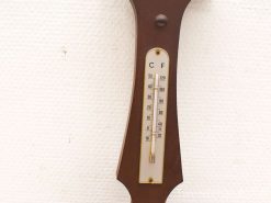 Vintage wooden thermometer with mercury column, Celsius and Fahrenheit display, perfect for retro decor.
