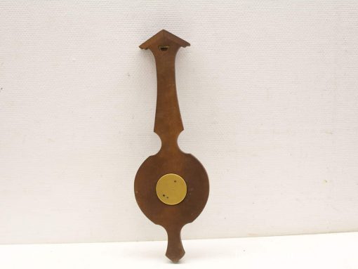 Handcrafted cherry wood barometer with polished brass disc, combining elegance and functionality.