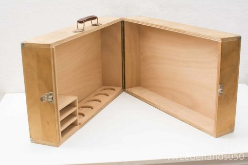 Versatile wooden storage box with compartments and shelves for organizing tools and crafts.
