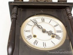Antique wooden clock with Roman numerals, glass cover, and elegant craftsmanship - timeless decor piece.