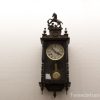 Elegant vintage wall clock with rearing horse motif and pendulum, perfect for classic decor.