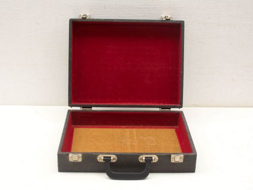Timeless vintage briefcase with red interior, perfect for documents and stylish organization.