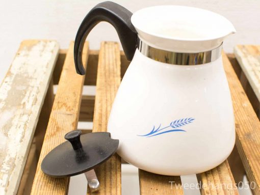 Elegant vintage white coffee pot with blue motif and black lid for stylish kitchen decor.