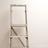Vintage metal ladder with patina, ideal for home improvement and stylish projects.