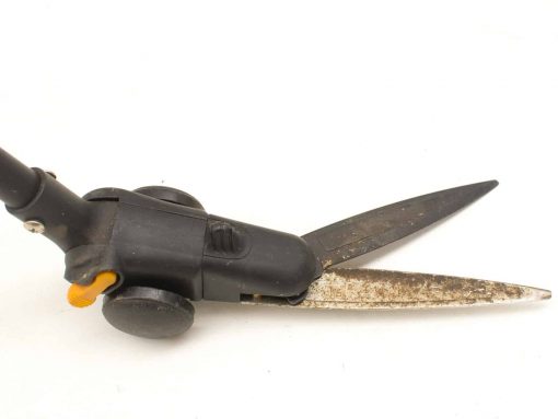 Ergonomic gardening shears with wheels for easy trimming of grass and hedges.