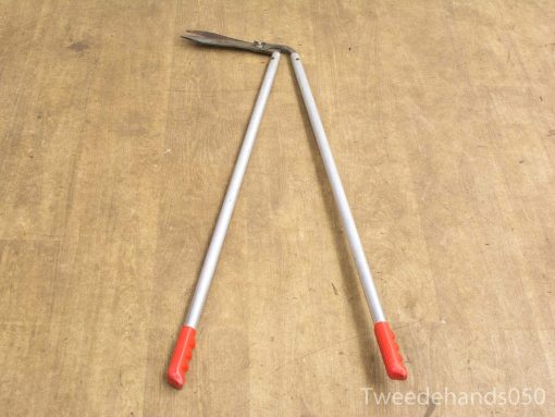 Ergonomic garden shears with red grips for precise pruning and plant maintenance.