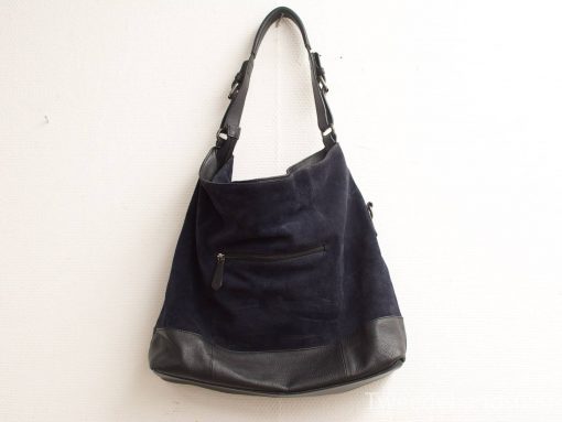 Chic navy suede shoulder bag with leather base, stylish and functional for any occasion.