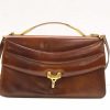 Timeless deep brown leather handbag with gold clasp and versatile carrying options.
