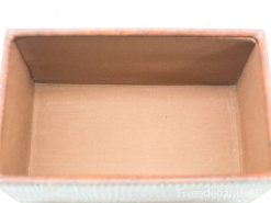 Vintage wooden storage box with luxurious lining, perfect for keepsakes or decorative display.