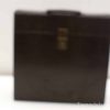 Elegant vintage brown leather briefcase with secure clasp, perfect for professionals and important documents.