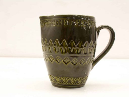Elegant dark green ceramic mug with unique patterns, perfect for everyday use or as a collectable.