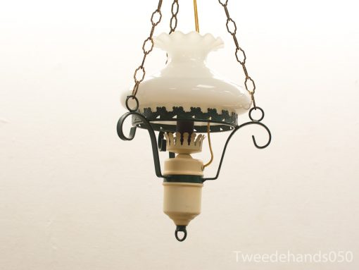 Vintage hanging lamp with frosted glass shade and ornate metal details, perfect for nostalgic interiors.