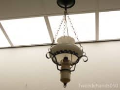 Elegant vintage chandelier with frosted glass shade, adding charm and warmth to any space.