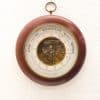Elegant vintage wooden barometer with detailed pressure gauge and rich reddish-brown finish.