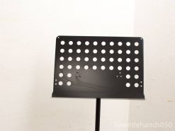 Sleek black metal music stand with adjustable height and stylish hole pattern for musicians.