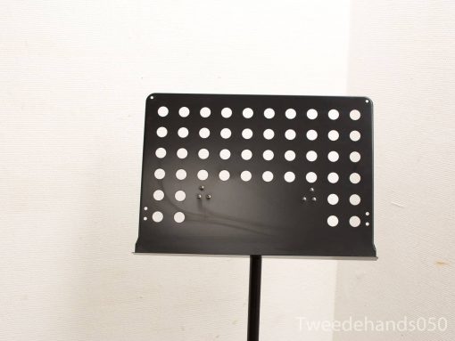 Sleek black metal music stand with adjustable height and stylish hole pattern for musicians.