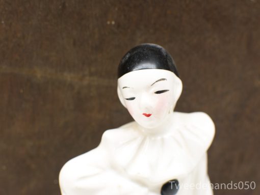 Charming black and white porcelain Pierrot figurine, perfect for collectors and adding theatrical flair.