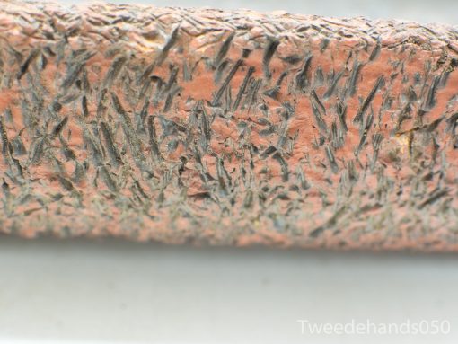 Textured reddish-brown terracotta flower pot with vintage appeal and unique handcrafted details.