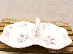 Elegant vintage porcelain serving dish with floral patterns and a delicate pink rim.