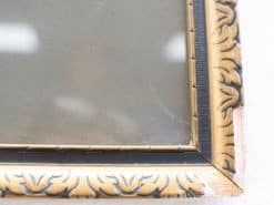 Ornate gold picture frame with floral patterns, ideal for showcasing cherished memories.