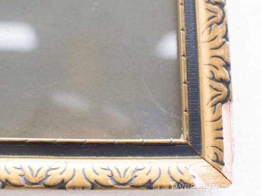 Ornate gold picture frame with floral patterns, ideal for showcasing cherished memories.